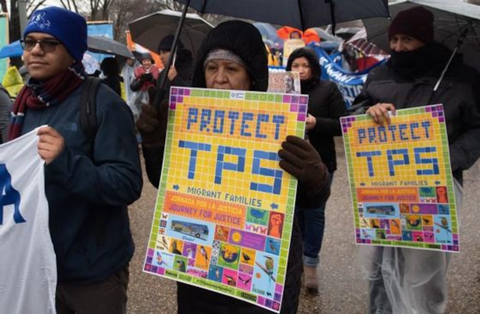 Demonstrators participate in the March For TPS(temporary protected status) Justice as they...