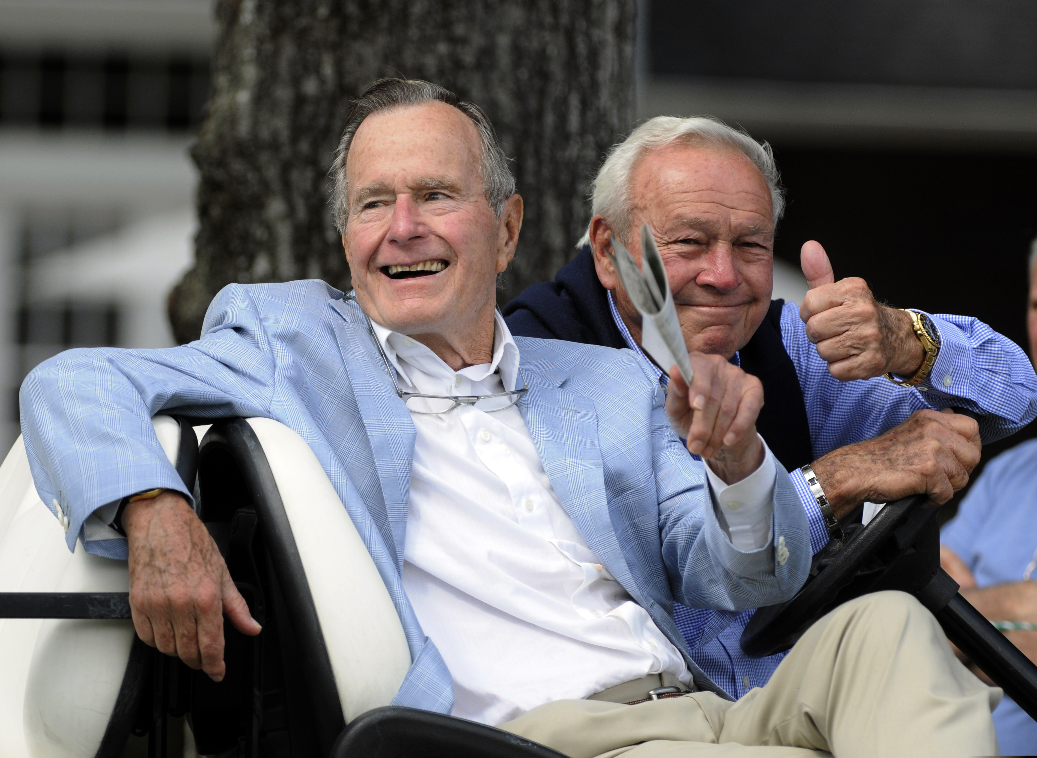 FILE - In this Oct. 22, 2010, file photo, Former President George H. W. Bush, left, and...