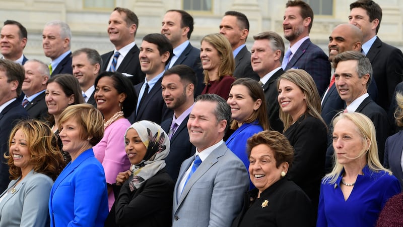 Members of the freshman class of Congress pose for a photo opportunity on Capitol Hill in...
